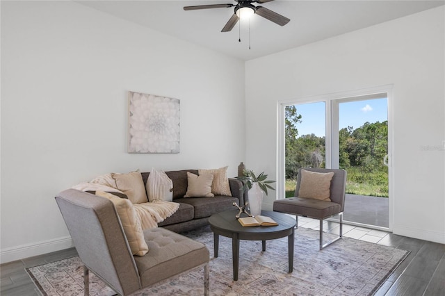 living room featuring ceiling fan and hardwood / wood-style floors