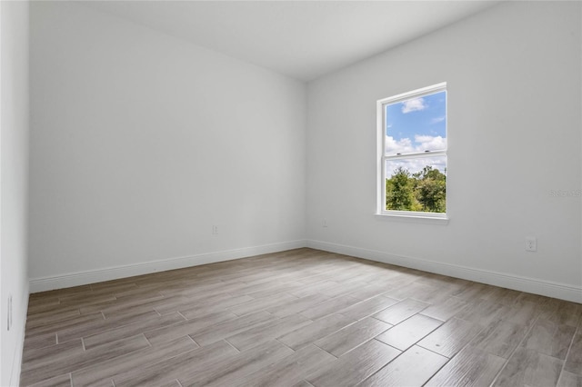 unfurnished room featuring light hardwood / wood-style flooring