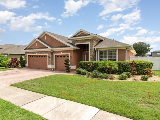 view of front facade featuring a front lawn and a garage