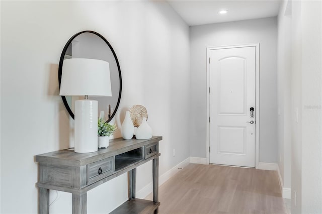 entryway with light hardwood / wood-style floors