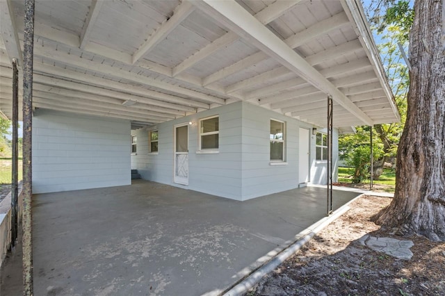 view of property exterior with a carport