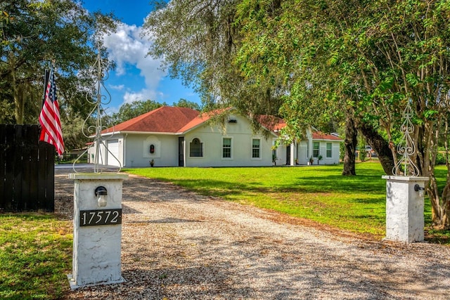 view of front of home featuring a front lawn