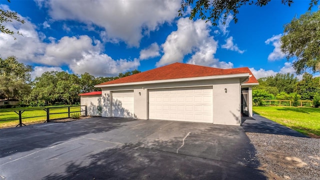 garage featuring a yard