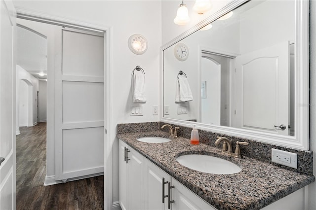 bathroom featuring hardwood / wood-style flooring and vanity