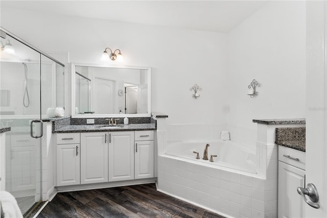 bathroom with vanity, separate shower and tub, and hardwood / wood-style floors