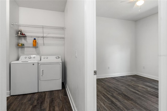 laundry room featuring washing machine and clothes dryer, dark wood-type flooring, and ceiling fan