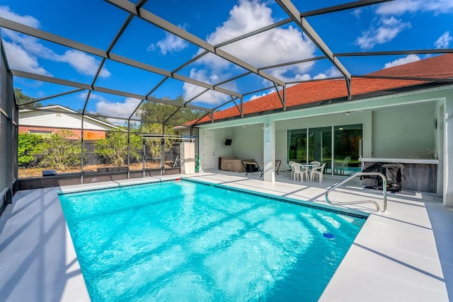 view of pool featuring a lanai and a patio area