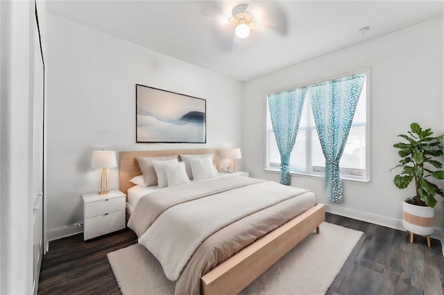 bedroom featuring dark hardwood / wood-style flooring and ceiling fan