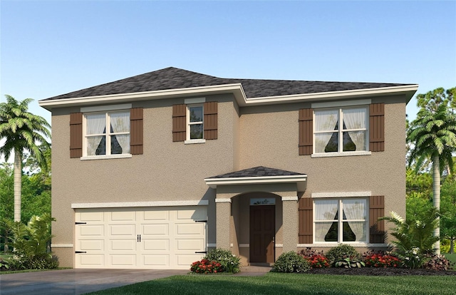 view of front of property with a garage and a front yard