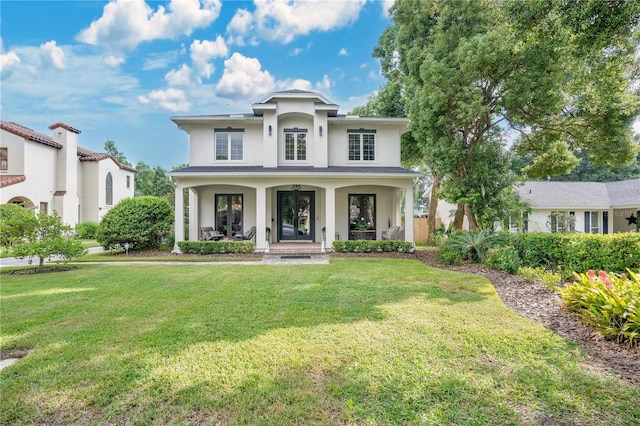 view of front of home with a front lawn and covered porch