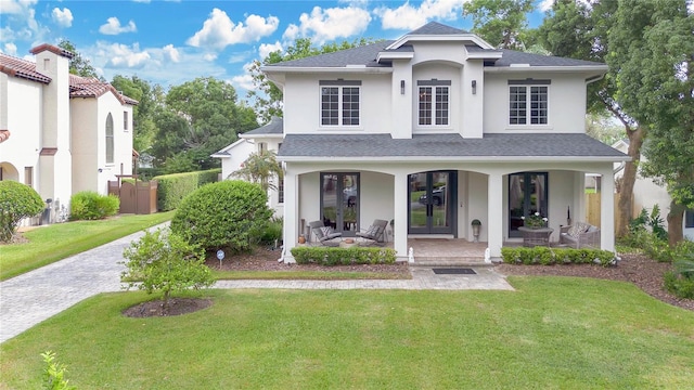 view of front of property featuring a front yard and covered porch