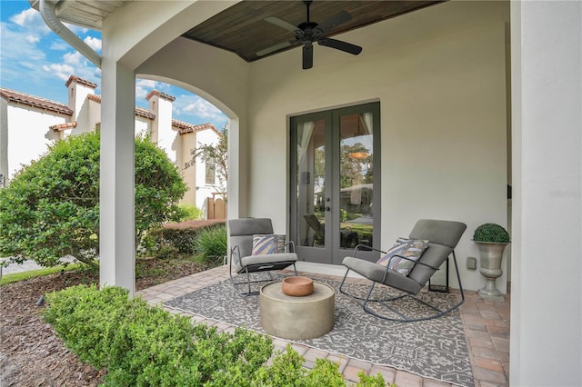 view of patio / terrace featuring ceiling fan and french doors