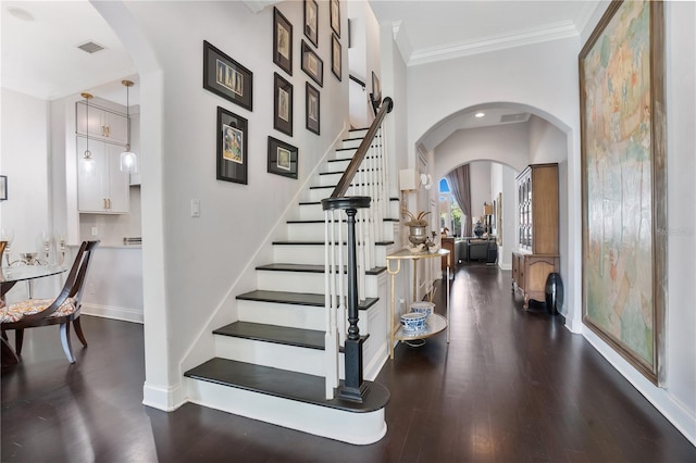 interior space featuring crown molding and dark wood-type flooring