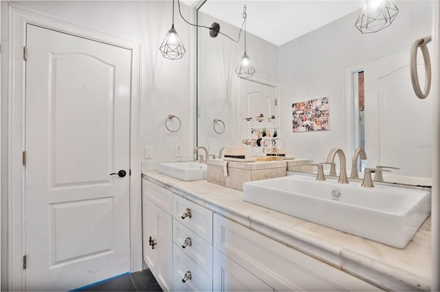 bathroom featuring tile patterned flooring and vanity