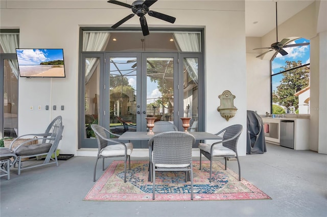 interior space featuring ceiling fan and french doors