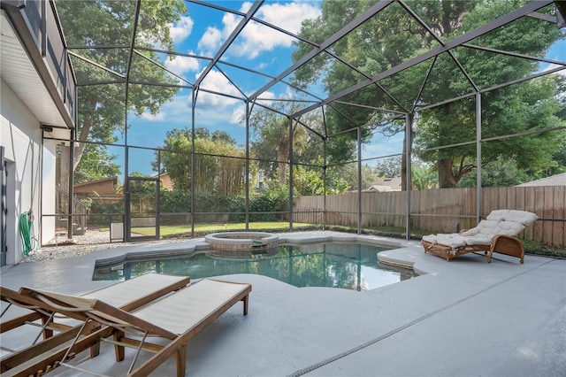 view of swimming pool featuring a lanai, a patio, and an in ground hot tub