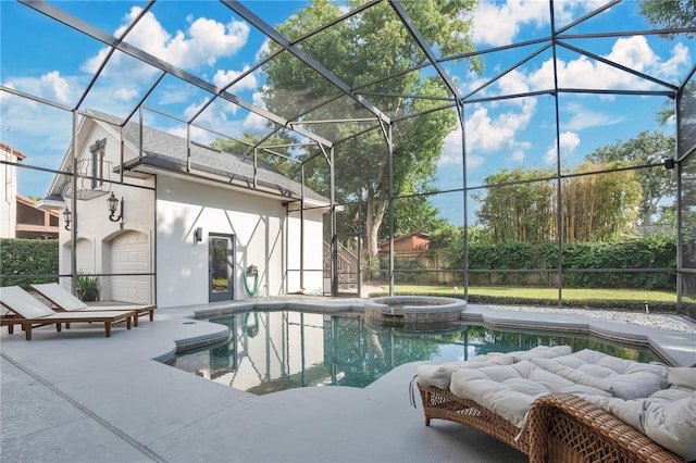 view of pool with a patio, an in ground hot tub, and glass enclosure