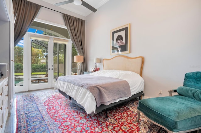 bedroom featuring ceiling fan, french doors, and access to exterior