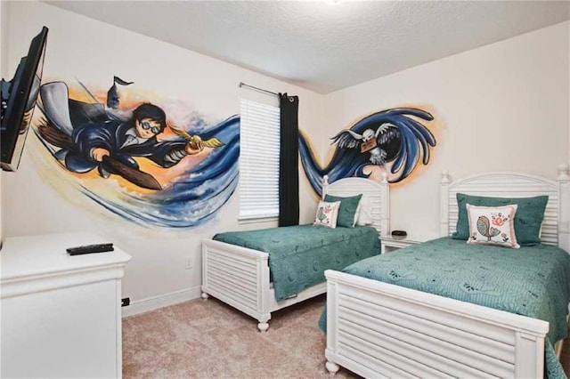 bedroom featuring light carpet and a textured ceiling