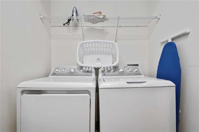 washroom with washing machine and dryer