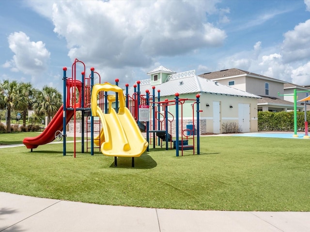 view of jungle gym featuring a lawn