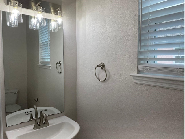 bathroom featuring sink and toilet