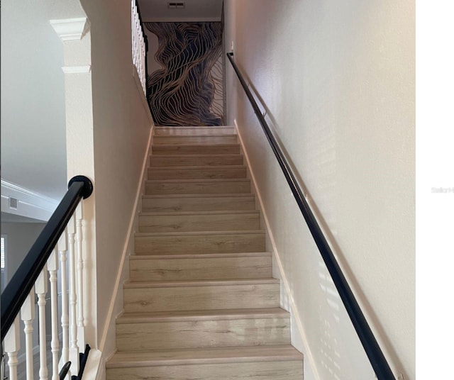 stairs with hardwood / wood-style floors