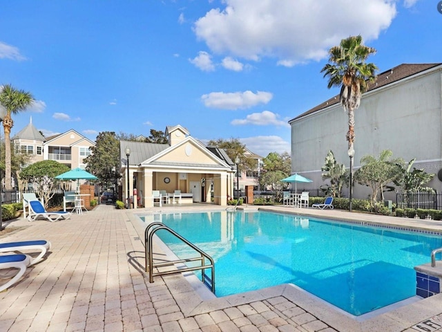 view of swimming pool with a patio area