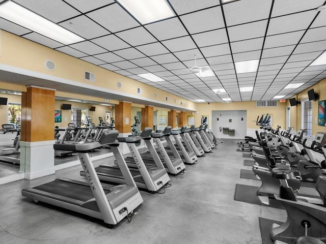 gym featuring a drop ceiling