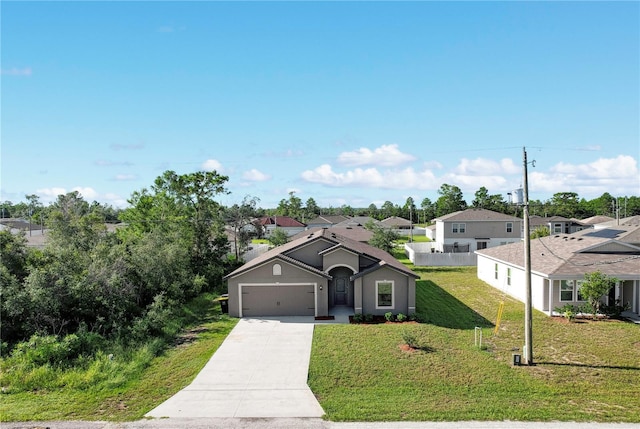 single story home featuring a front yard and a garage