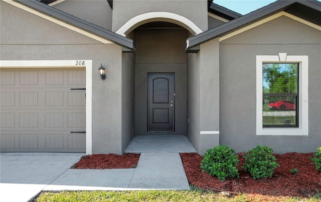 property entrance featuring a garage