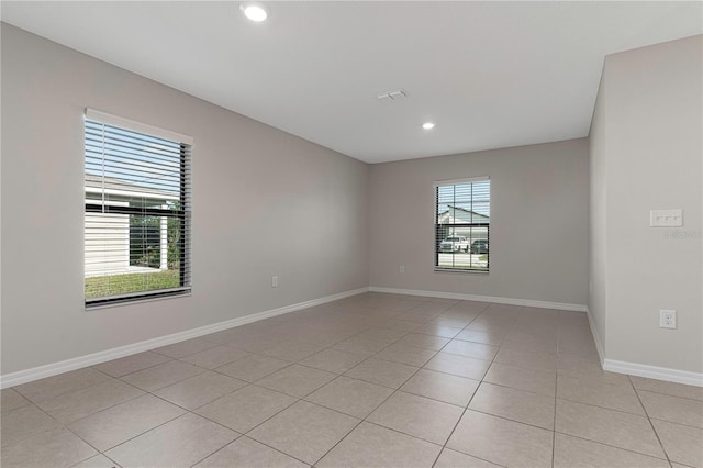 unfurnished room with light tile patterned floors