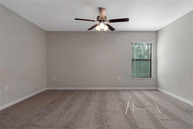 empty room with carpet and ceiling fan