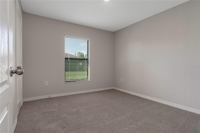 empty room featuring carpet flooring