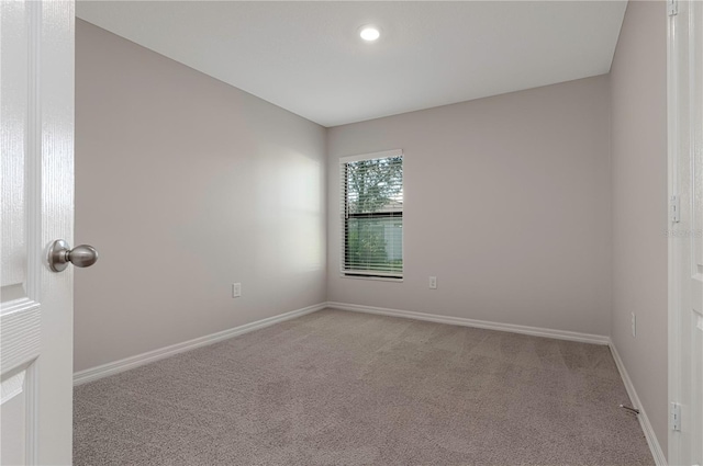 208 Hyacinth Ct, Kissimmee, FL 34759 - carpeted empty room featuring baseboards and recessed lighting