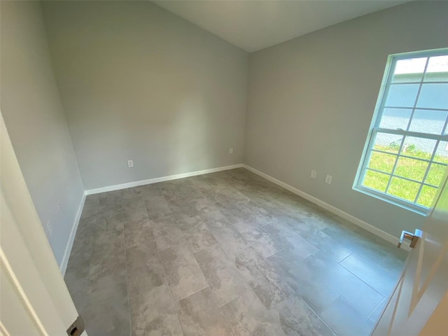 empty room with light tile patterned floors