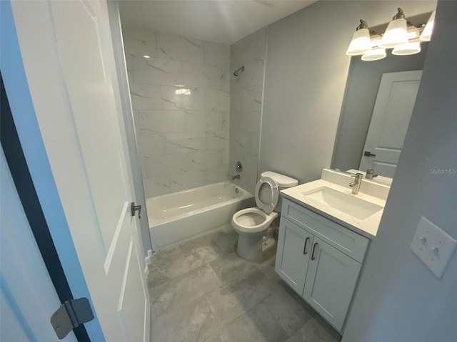 full bathroom with tiled shower / bath, toilet, and vanity