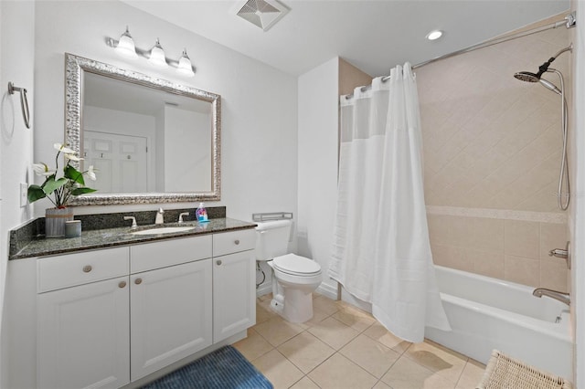 full bathroom with vanity, toilet, tile patterned floors, and shower / bath combo