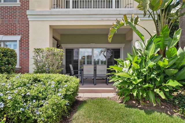 doorway to property featuring a balcony