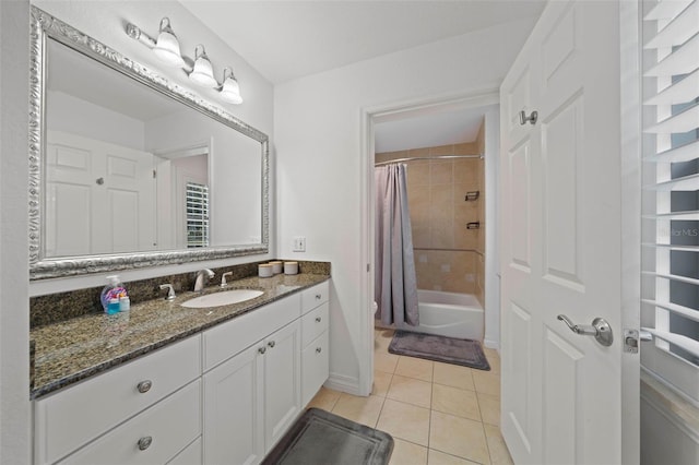 bathroom featuring vanity, shower / tub combo with curtain, and tile patterned floors