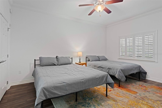 bedroom with ceiling fan, dark hardwood / wood-style floors, and ornamental molding