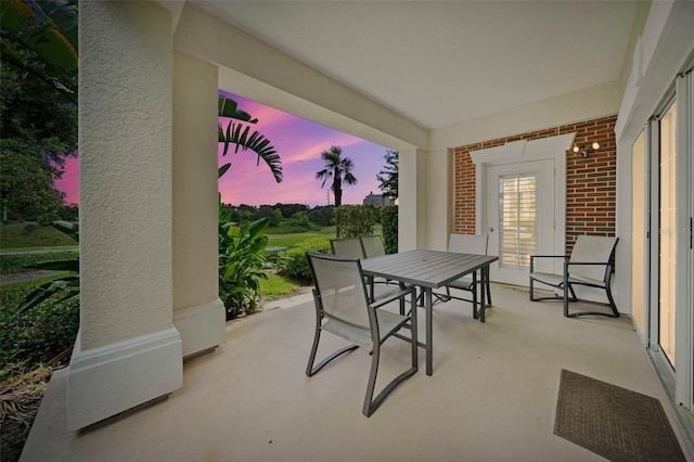 view of patio terrace at dusk