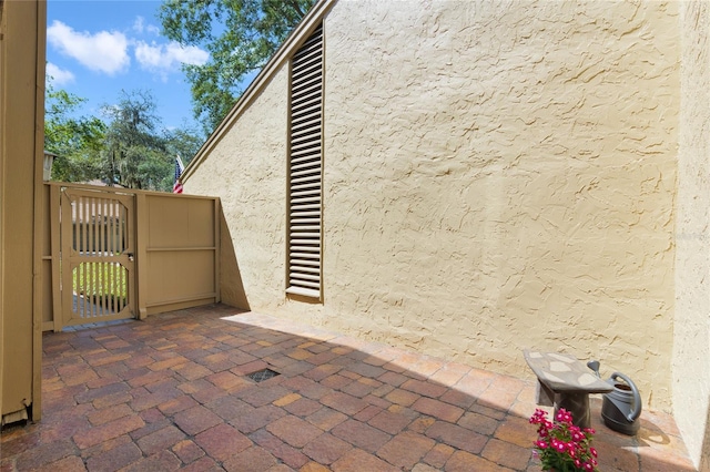 view of patio / terrace featuring a gate