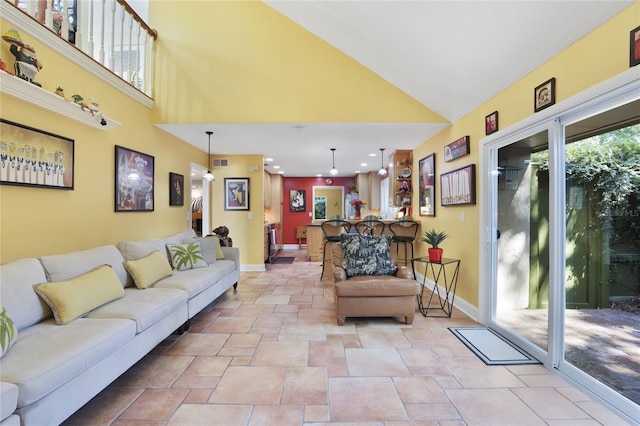 living room featuring high vaulted ceiling