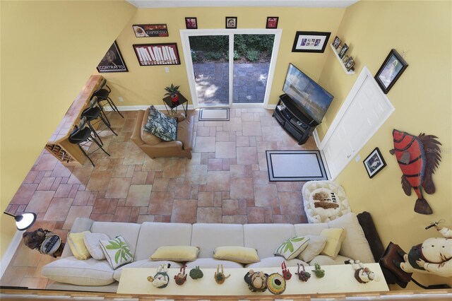 living room with high vaulted ceiling