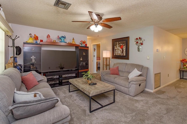 carpeted living room featuring a textured ceiling and ceiling fan