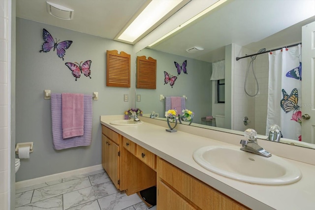 bathroom featuring vanity, toilet, and walk in shower