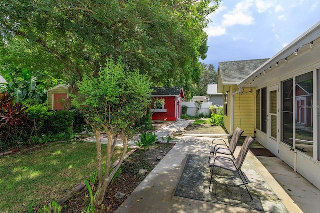 view of patio / terrace featuring a storage unit