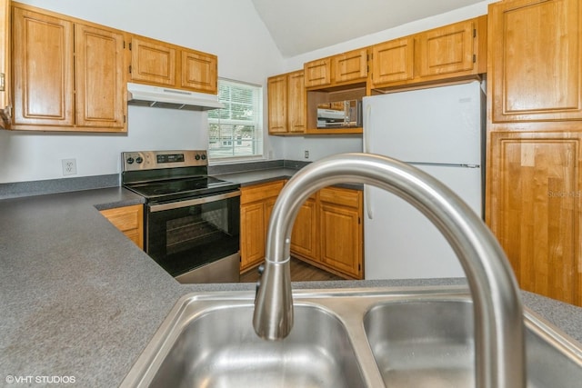 kitchen featuring vaulted ceiling, sink, white fridge, and stainless steel electric range