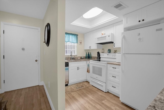 kitchen featuring light wood-type flooring, sink, white appliances, and white cabinetry